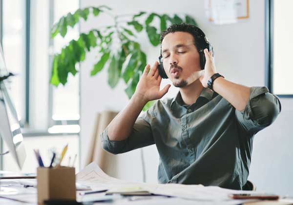 Businessman Listening To Music